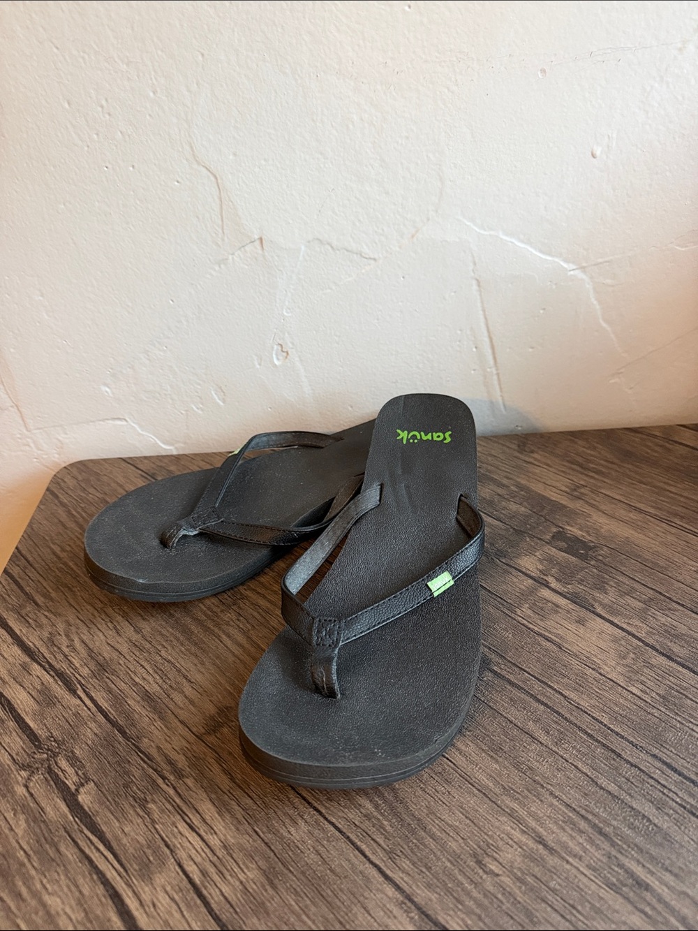 Sanuk Black Flip Flops with Green Logo Accent